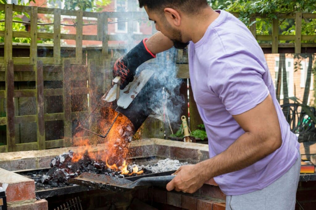 How to add more charcoal while cooking on a charcoal BBQ grill