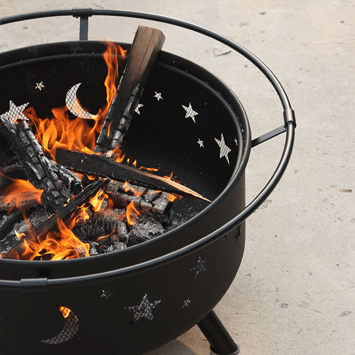 Chimney starter lighting charcoal for a BBQ grill